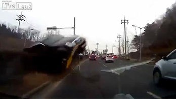 In-car camera catches SUV jumping median, crashing through windshield
