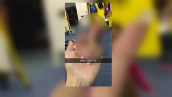 Day care worker fired for photo apparently showing her in obscene gesture toward kids