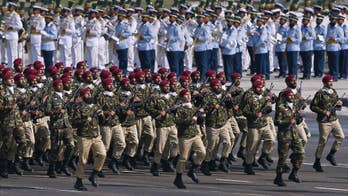 Pakistani president at military parade offers talks to India