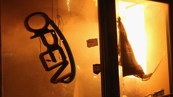 Ferguson businesses - among them a Mexican restaurant - anxiously wait for unrest to fade