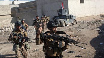 Heavy fighting as Iraqi troops drive deeper into Mosul