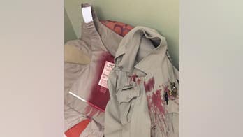 Sheriff's Department posts photo of deputy's blood-soaked uniform after vicious dog attack