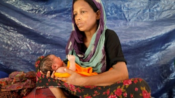 Boat carrying Rohingya Muslims capsizes, killing at least 12