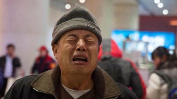 Flight 370 victims' families angry, resigned as search ends