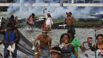 Brazil police shoot tear gas at Indians, who throw spears