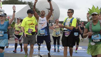 Double-amputee veteran and his CEO guide bond over marathons