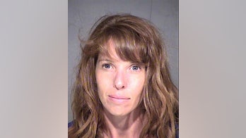 Deranged woman crawls through doggy door to attack two young girls who were home alone, officials say