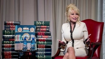 Dolly Parton's nonprofit marks 100 millionth book donation, gives it to Library of Congress