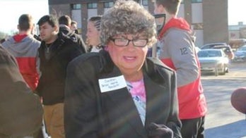 Unclear why RI official persuaded man to dress as elderly woman for photo op