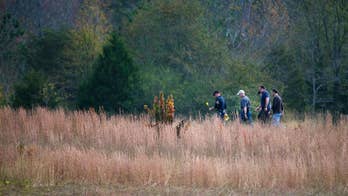 Woman found chained in container warns of bodies on property