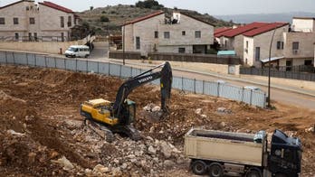 Israel passes law legalizing thousands of settlement homes