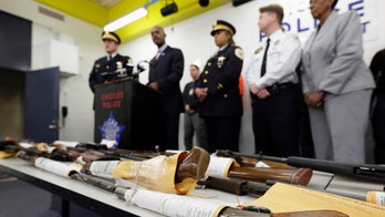 Illinois governor signs law expanding background checks for potential gun owners