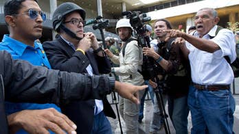 Venezuela opposition leader hit with a pipe in the face