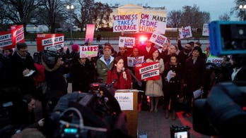 Experts: New travel ban more palatable, still problematic