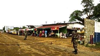 Liberia hunts escaped Ebola victims as WHO calls for controls
