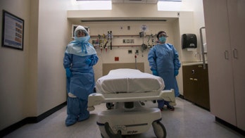 Hospitals improvise Ebola defenses, at a cost