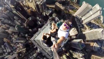 Daredevil teens take extreme selfie video on top of 1,000 ft skyscraper