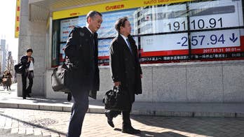 Japan central bank upgrades outlook, keeps policy intact