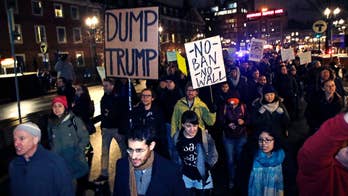 Protesters rally in Harvard Square against Trump travel ban