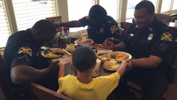 Florida boy asks to pray with police officers after eating breakfast