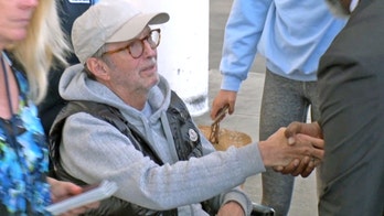 Eric Clapton seen in wheelchair after announcing he has 'severe bronchitis'