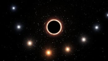 Star zooms past monster black hole, confirms relativity