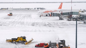Snow and wind paralyze European airports, trap drivers