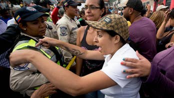 Venezuela steps up military presence in town hit by looting
