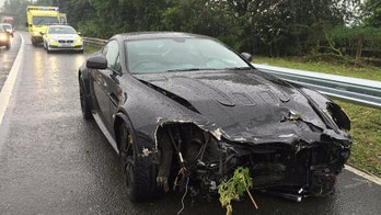 Mystery former racing ace smashes his $200,000 Aston Martin supercar