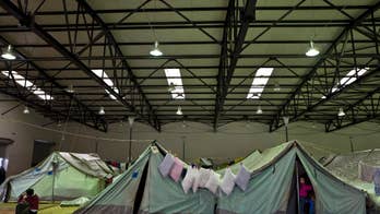 AP PHOTOS: Burned out migrants in Greece try to keep sane