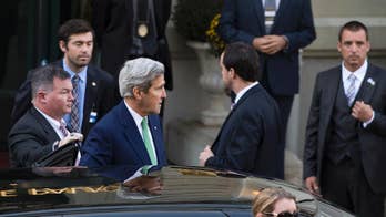 Ahead of Syria talks, Kerry visits Rwanda genocide memorial