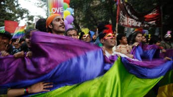 Gay rights activists march in New Delhi parade
