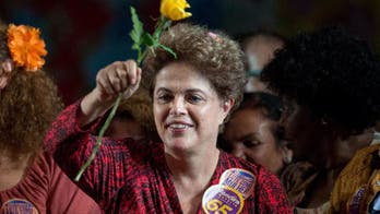 Brazil's ousted leader defends predecessor against charges