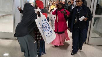 The Latest: State officials to discuss travel ban lawsuits