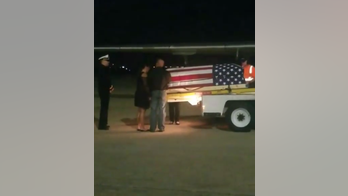 Fallen soldier's arrival home brings plane's passengers to tears
