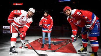 NHL's Ovechkin shoots the puck with female Muslim hockey player