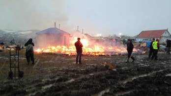 Remnants of pipeline protest camp go up in flames