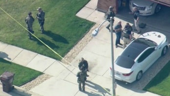 Two FBI agents wounded near Chicago; subject of warrant found dead