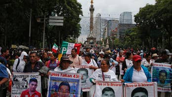 Families of missing 43 students lead march in Mexico