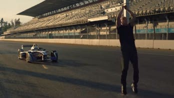Watch stunt man's blind backflip over a moving Formula E race car