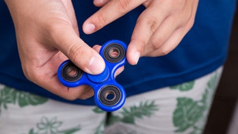 Senators play with fidget spinners, stress balls to pass time during impeachment