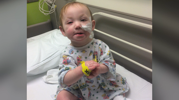 Dad pens song for son battling congenital heart condition