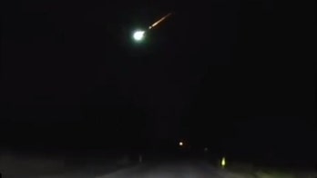Police dashcam captures stunning footage of fireball streaking across the sky