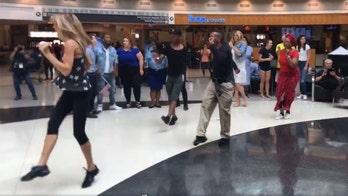 Alabama woman plans airport flash mob for husband who doesn't make it to airport
