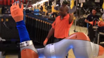 Ford's genius co-bots can build cars, make coffee, and even give massages