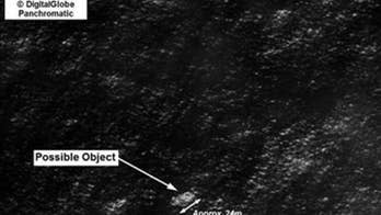 Satellites spot possible objects from missing Malaysian jet, Australia says
