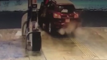 Woman dragged during carjacking at Massachusetts gas station, suspect at large, police say