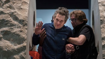 French artist emerges after spending week inside a rock