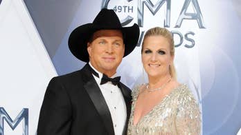 Garth Brooks has 'been in love ever since' Trisha Yearwood put 'Carhartts on' to mend a fence