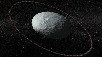 There's a giant egg floating in our solar system with a ring around it